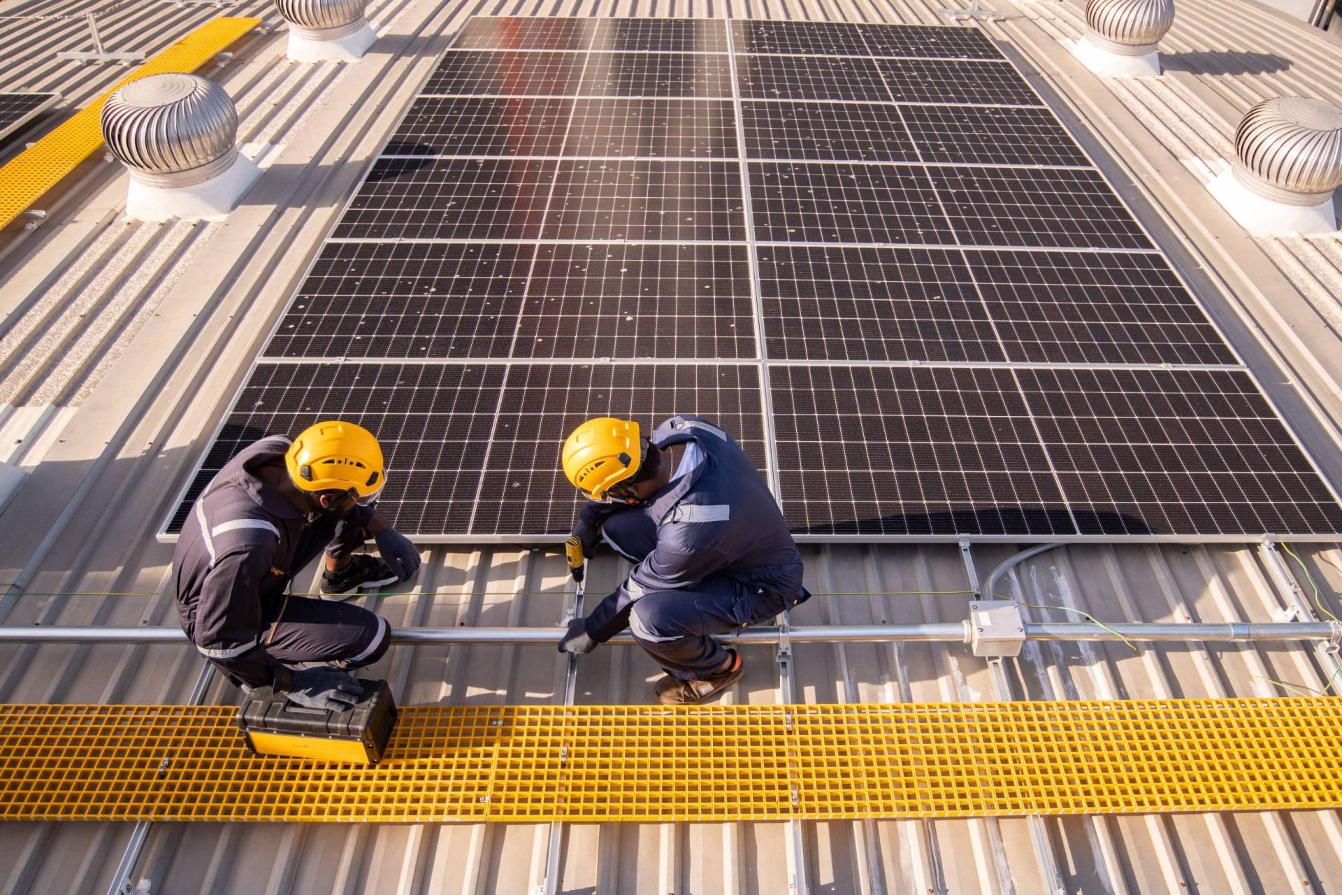 Engineers installing solar panels